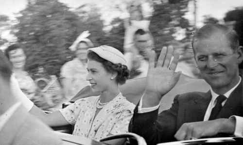 Queen Elizabeth II and Prince Philip, the Duke of Edinburgh, waving to Rockhampton residents as they drove along Bolsover Street on their 1954 visit to Rockhampton. Queen Elizabeth II and Prince Philip, the Duke of Edinburgh, waving to Rockhampton residents as they drove along Bolsover Street on their 1954 visit to Rockhampton.